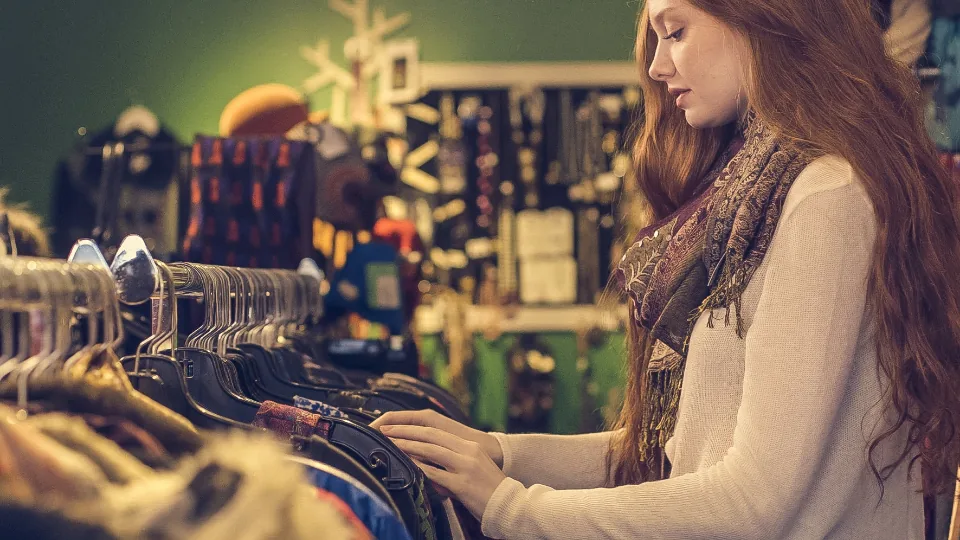 Woman browsing clothes in a shop