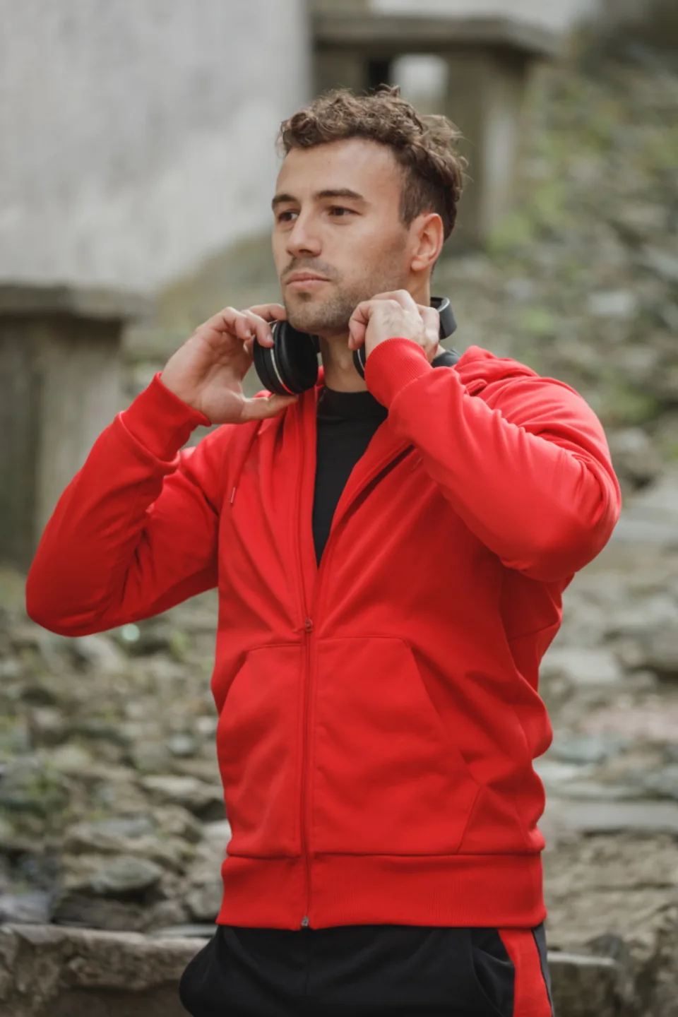 Man wearing a red track jacket